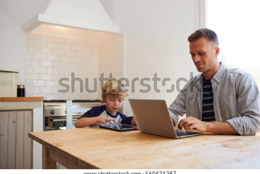father and son at kitchen table