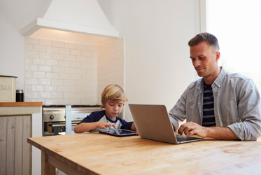 father and son at kitchen table